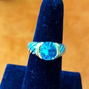 Silver ring with light blue stove